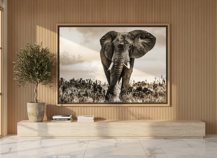 Oversized statement canvas wall art with a natural timber surround styled on the wall in a luxe living room