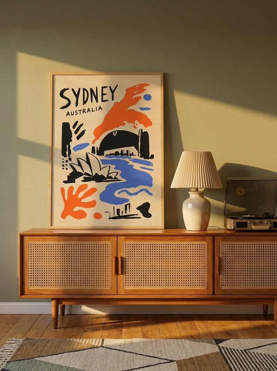 Modern wall art print standing on a sideboard in a mid-century bedroom