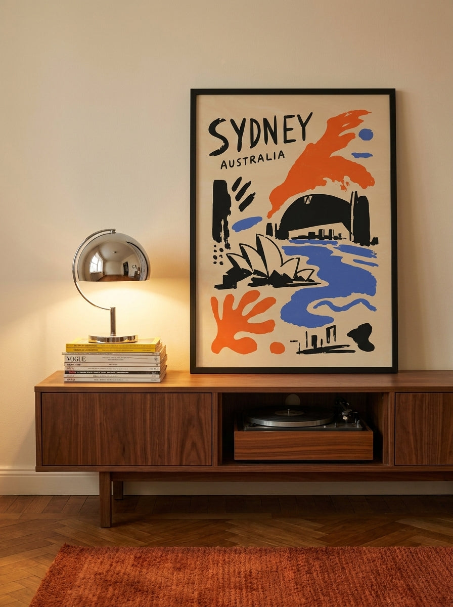 Modern wall art print standing on a sideboard in a retro 70s home office