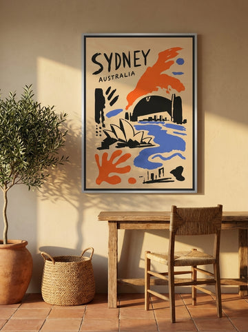 Canvas wall art with a silver leaf surround styled on the wall in a Mediterranean home office