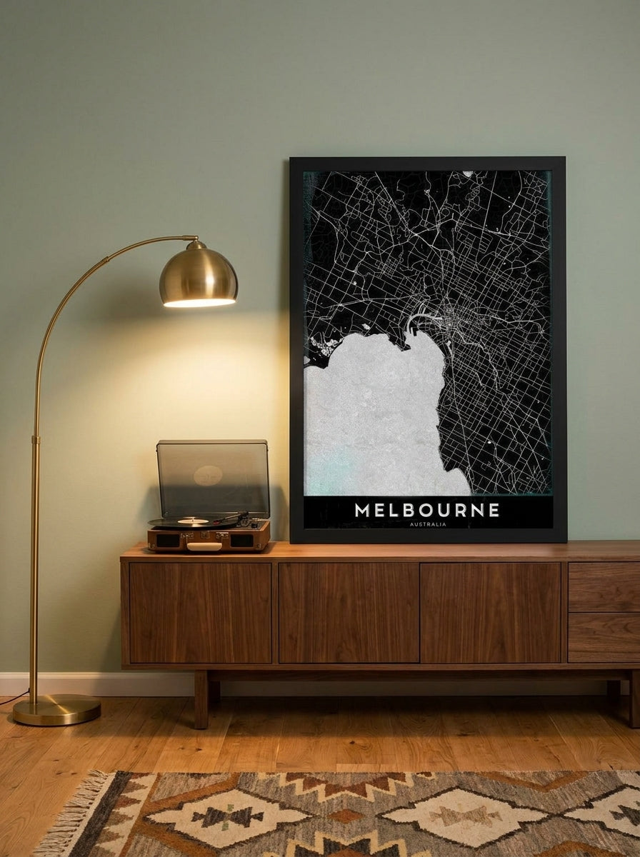 Modern wall art print standing on a sideboard in a mid-century home office