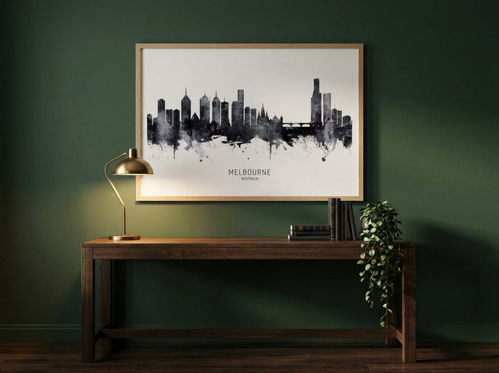 Modern wall art print styled on the wall in a moody home office