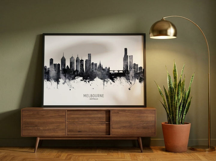 Modern wall art print standing on a sideboard in a mid-century home office