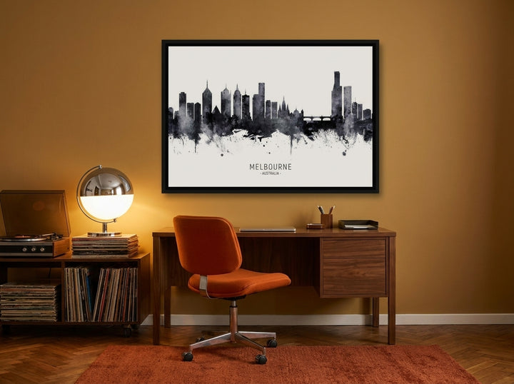 Canvas wall art with a black surround styled on the wall in a retro 70s home office