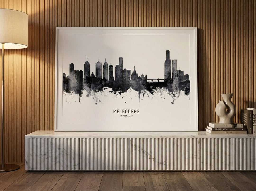 Modern wall art print standing on a sideboard in a luxe living room