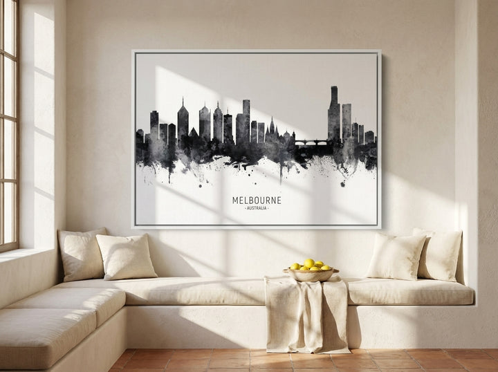 Oversized statement canvas wall art with a white surround styled on the wall in a Mediterranean living room