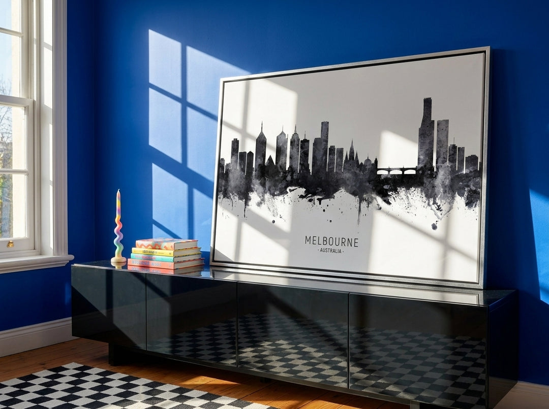 Canvas wall art with a silver leaf surround standing on a sideboard in a colourful eclectic dining room