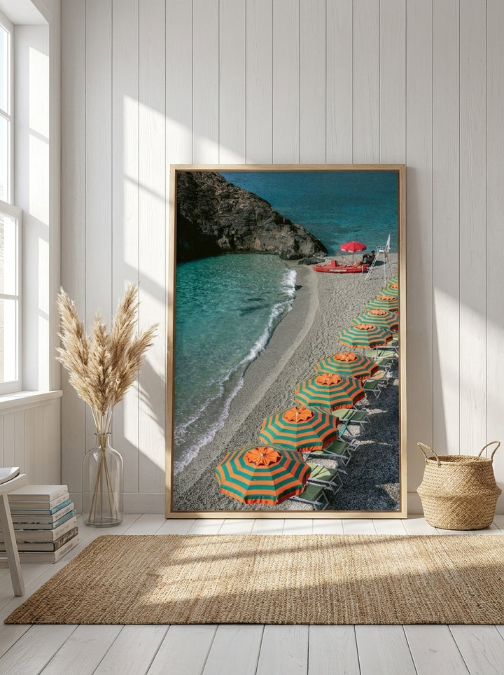 Oversized statement canvas wall art with a natural timber surround leaning against the wall in a coastal living room