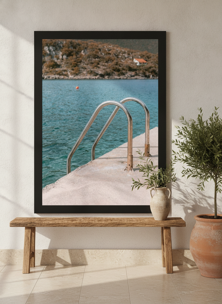 Modern wall art print standing on a bench in a Mediterranean bathroom