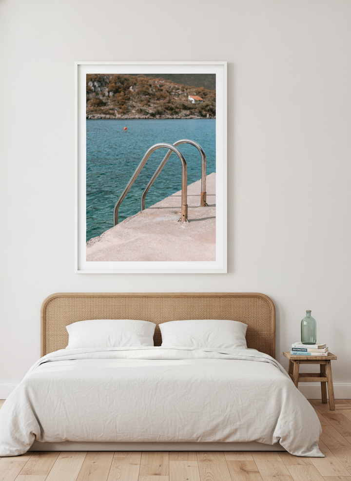 Oversized statement modern wall art print styled on the wall in a coastal bedroom