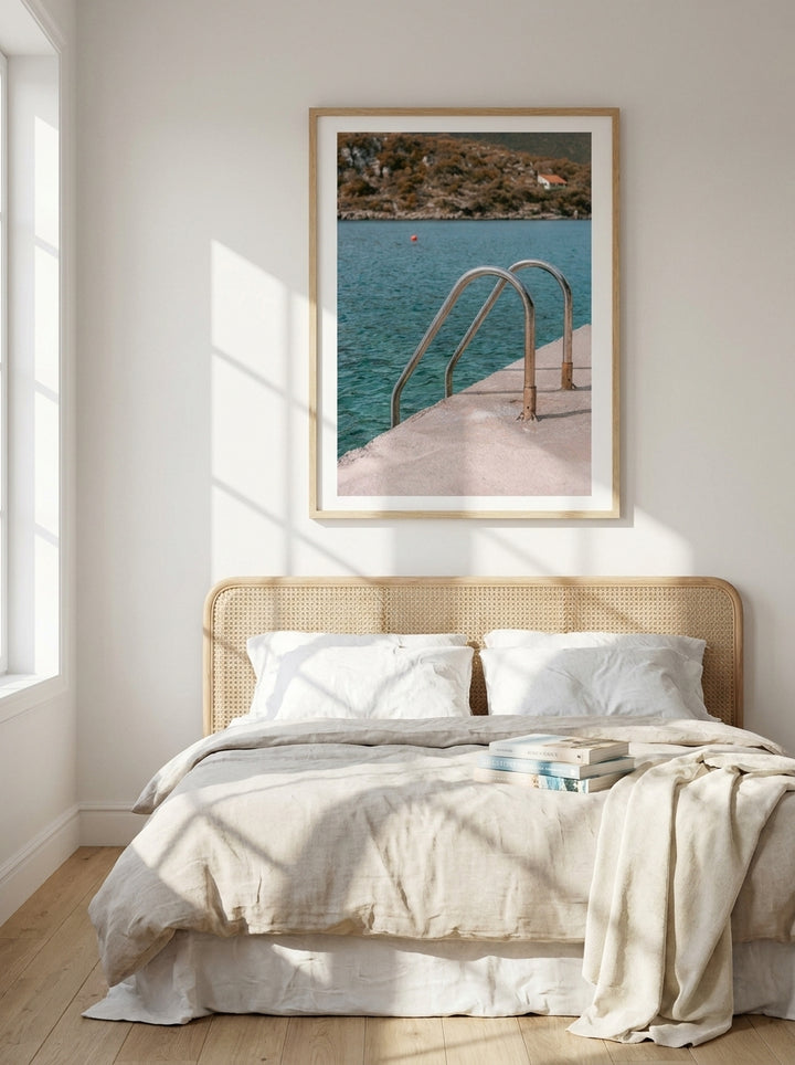 Modern wall art print styled on the wall in a coastal bedroom