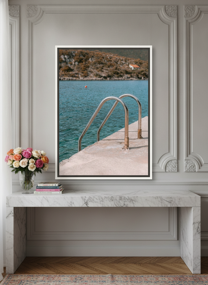 Canvas wall art with a white surround standing on a kitchen bench in a Parisian kitchen