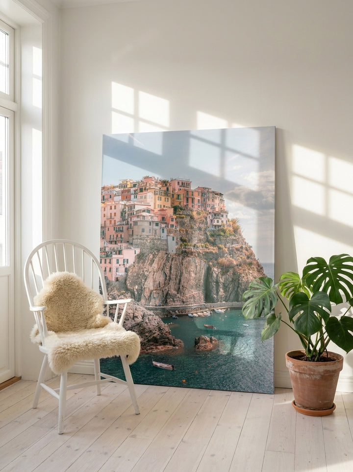 Stretched canvas wall art leaning against the wall in a bright Scandinavian home office