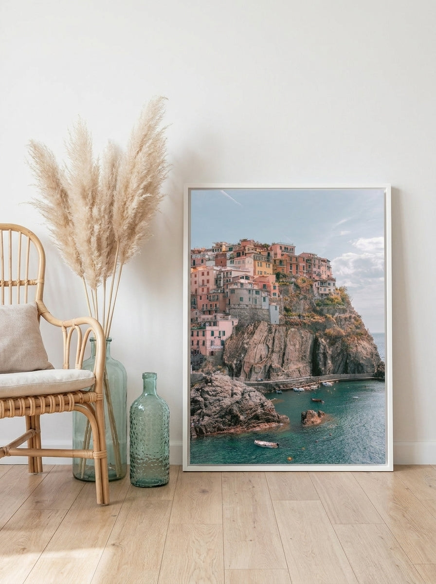 Canvas wall art with a white surround leaning against the wall in a coastal dining room
