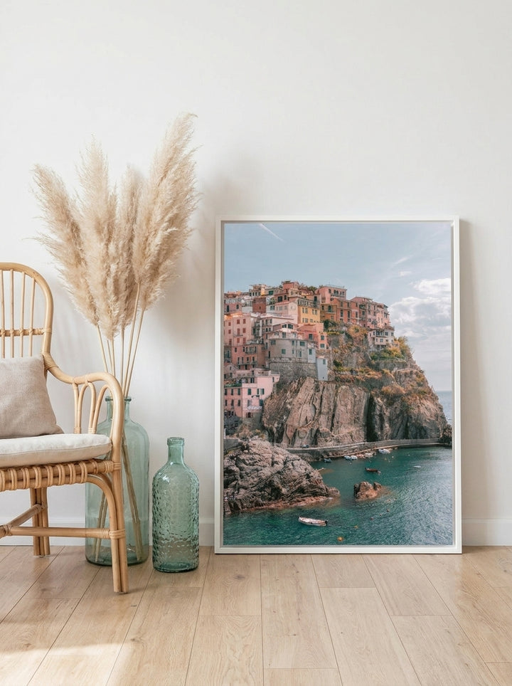 Canvas wall art with a white surround leaning against the wall in a coastal dining room