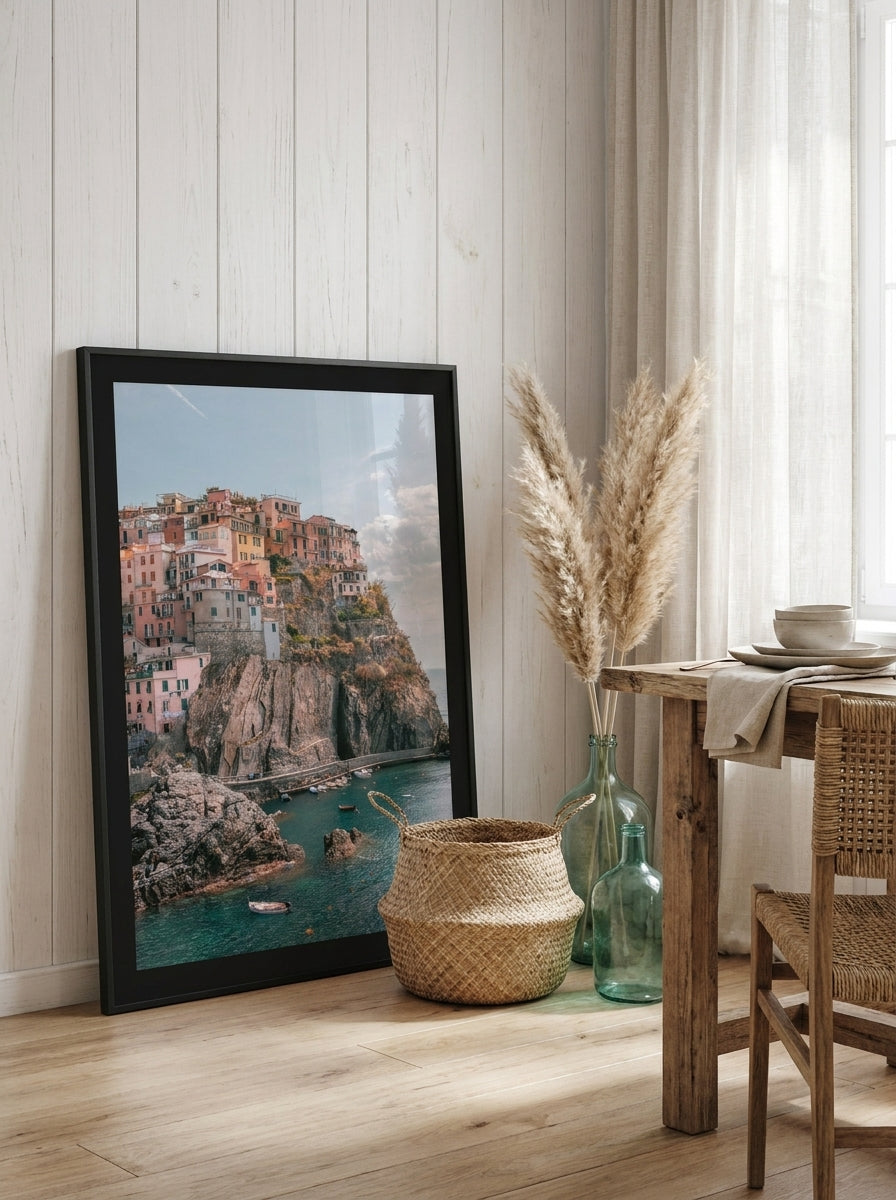 Modern wall art print leaning against the wall in a coastal dining room