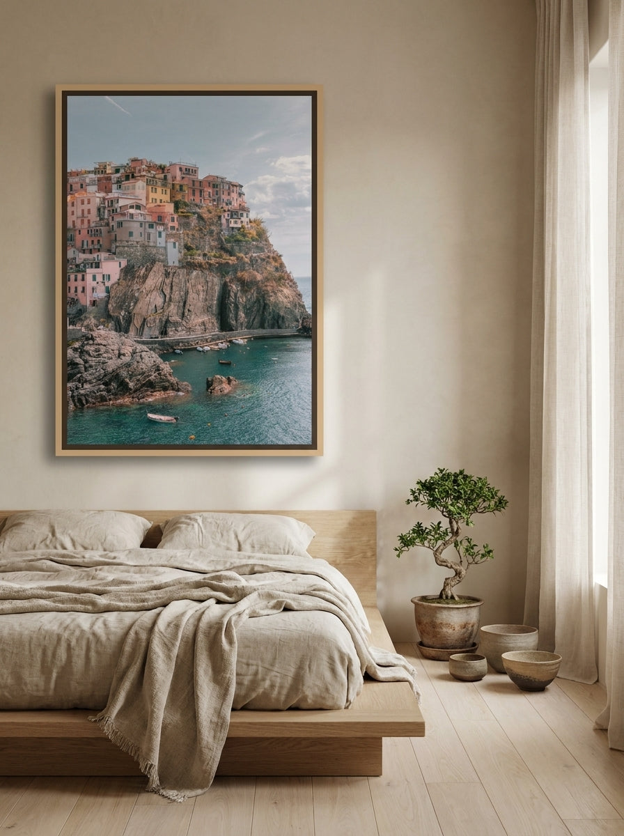 Canvas wall art with a natural timber surround styled on the wall in a warm Japandi bedroom