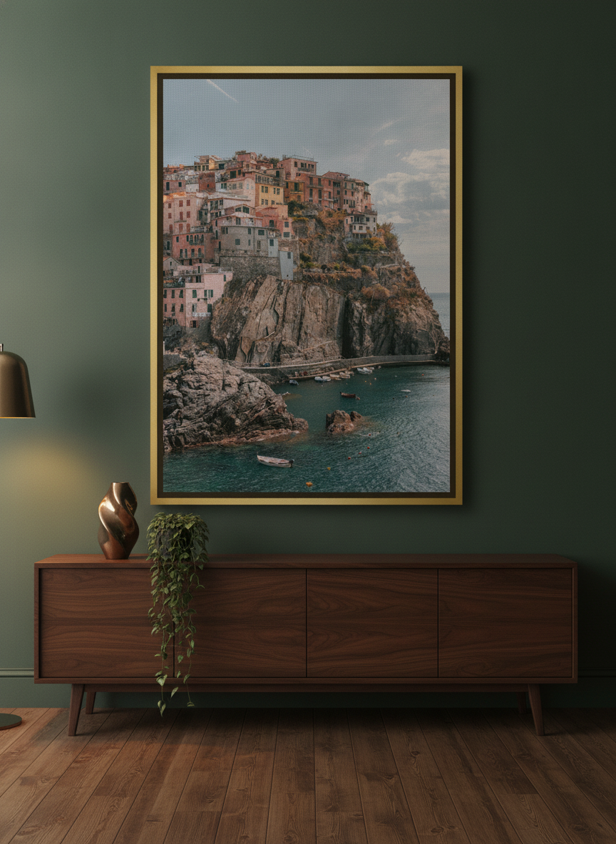 Oversized statement canvas wall art with a gold leaf surround styled on the wall in a moody living room