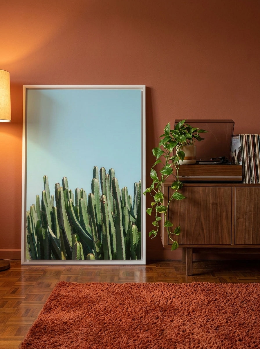 Canvas wall art with a white surround standing on a sideboard in a retro 70s bedroom