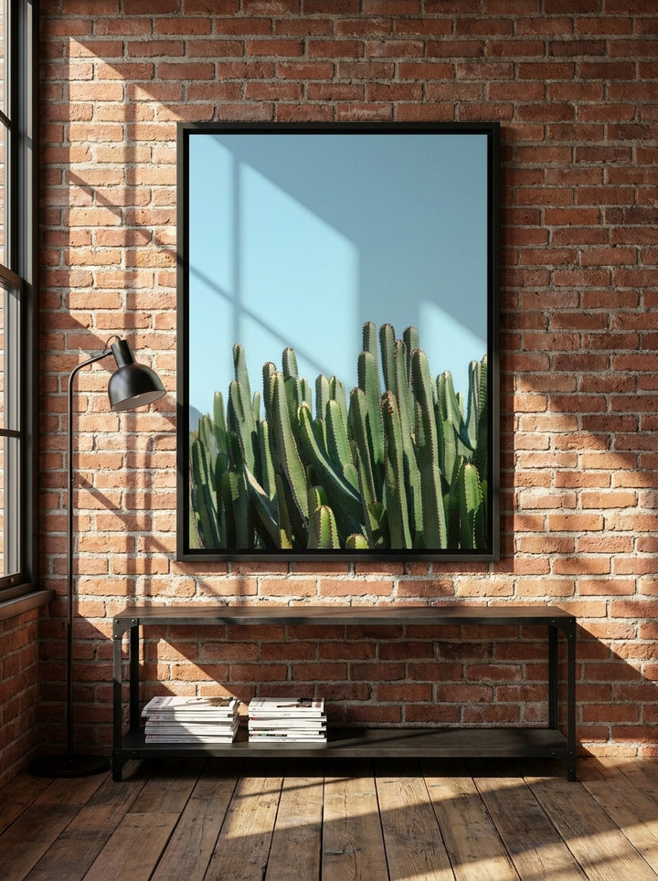 Canvas wall art with a black surround styled on the wall in an industrial loft living room