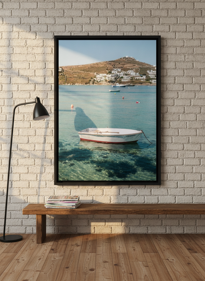 Canvas wall art with a black surround standing on a bench in an industrial loft bedroom