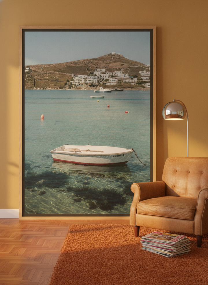 Oversized statement canvas wall art with a natural timber surround leaning against the wall in a retro 70s living room
