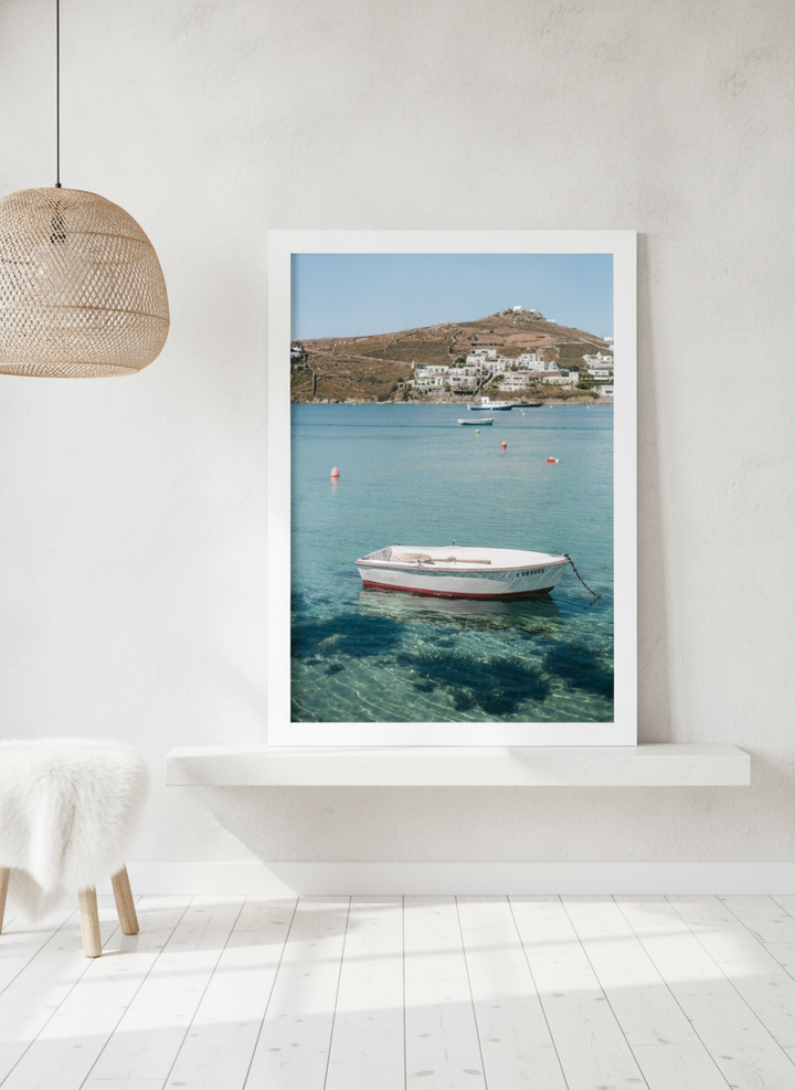 Modern wall art print standing on a shelf in a bright Scandinavian bedroom