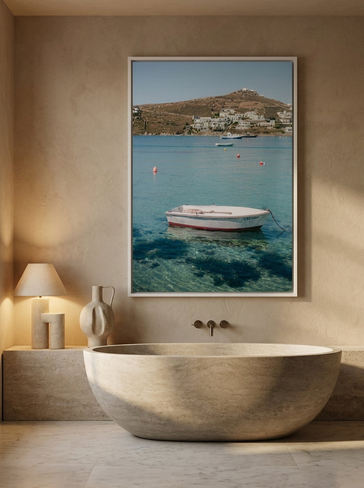 Canvas wall art with a white surround styled on the wall in a luxe bathroom