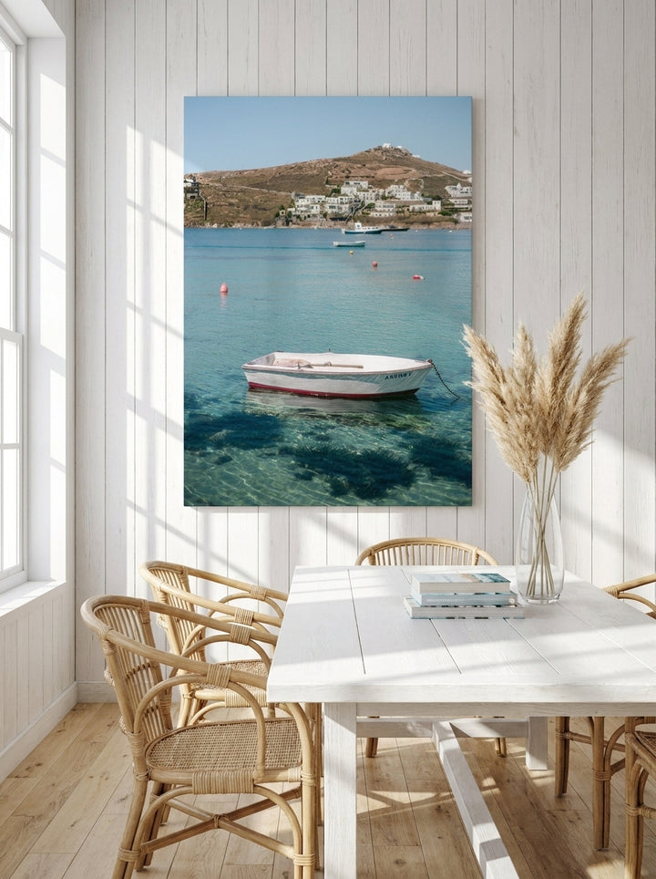Stretched canvas wall art styled on the wall in a coastal dining room