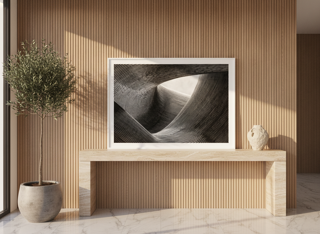 Modern wall art print standing on a console in a luxe dining room