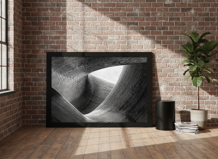 Oversized statement modern wall art print leaning against the wall in an industrial loft living room