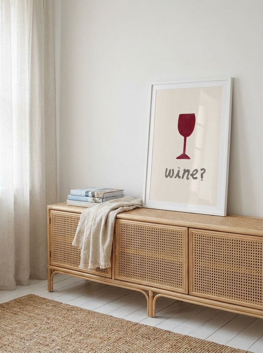 Modern wall art print standing on a sideboard in a coastal living room