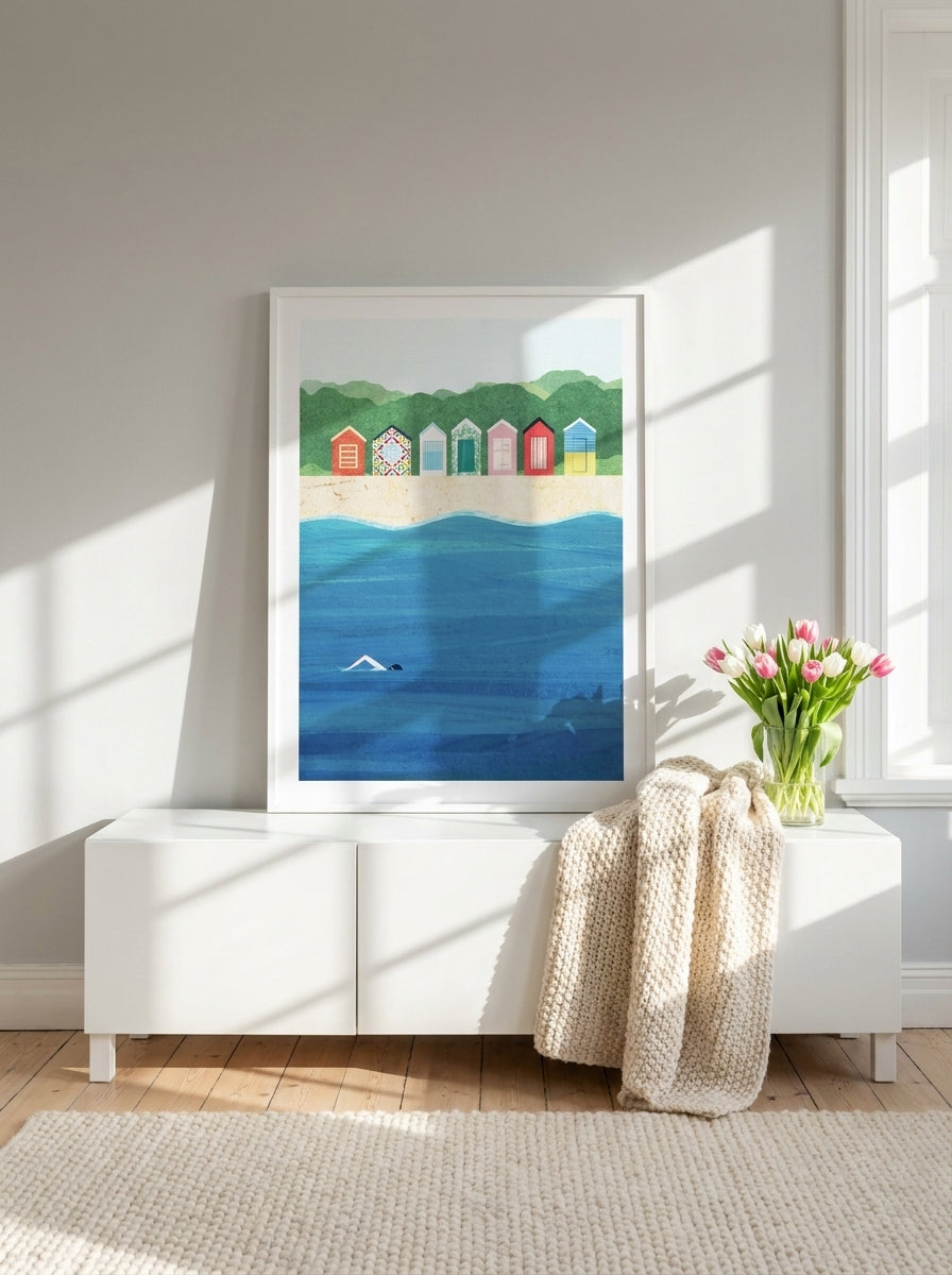 Modern wall art print standing on a sideboard in a bright Scandinavian bedroom