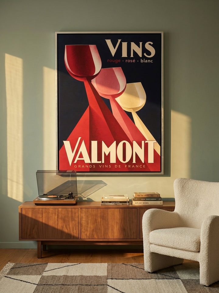 Oversized statement canvas wall art with a silver leaf surround styled on the wall in a mid-century living room