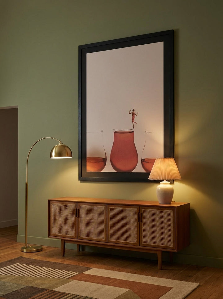 Oversized statement modern wall art print styled on the wall in a mid-century living room