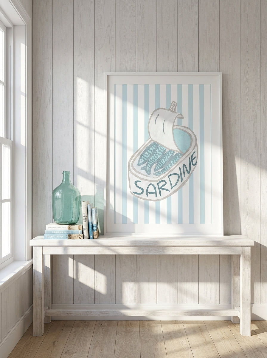Modern wall art print standing on a console in a coastal living room