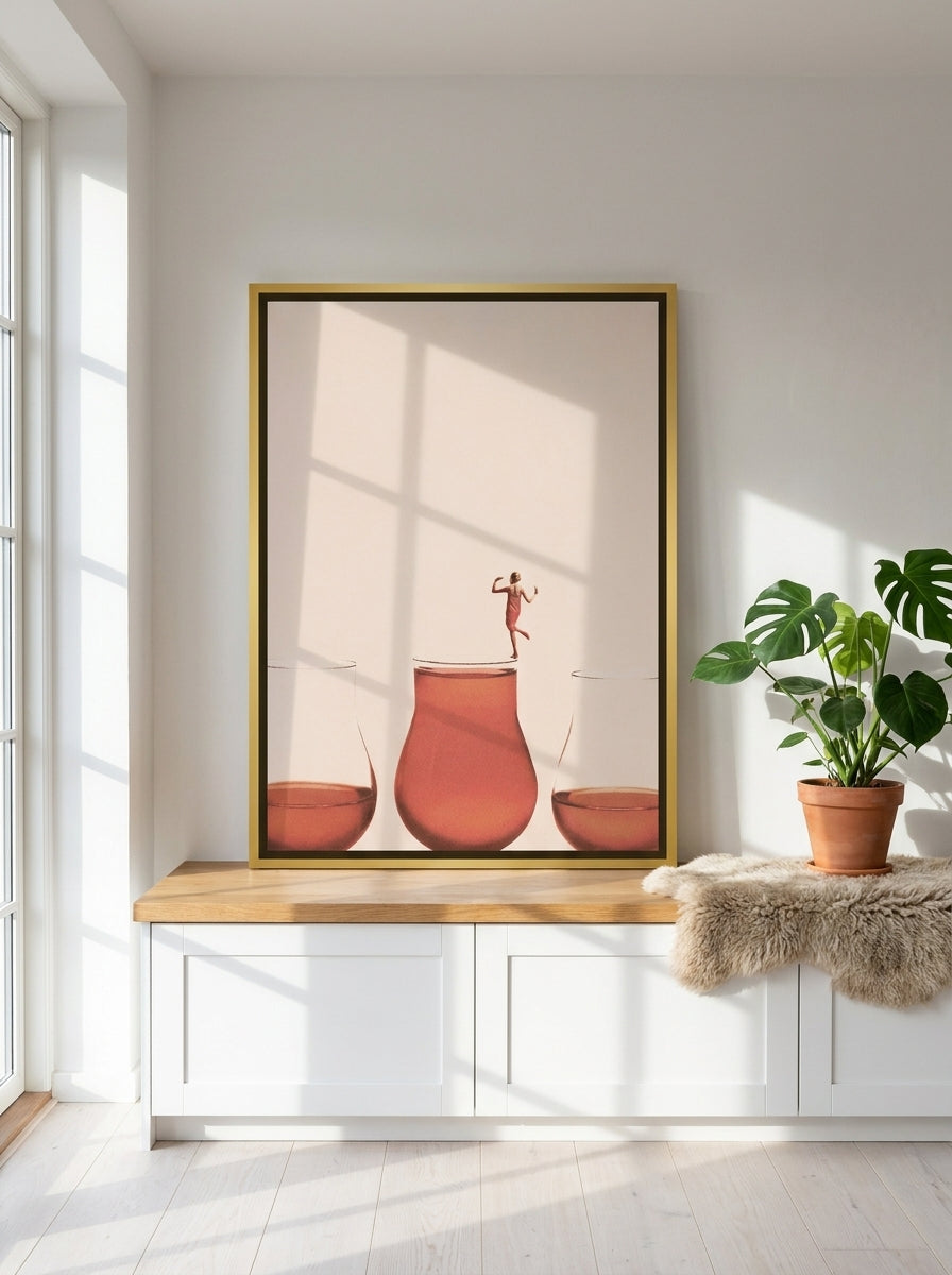 Canvas wall art with a gold leaf surround standing on a kitchen bench in a bright Scandinavian kitchen