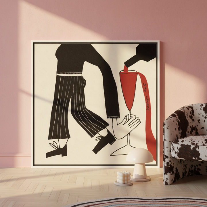 Canvas wall art with a white surround leaning against the wall in a colourful eclectic bedroom