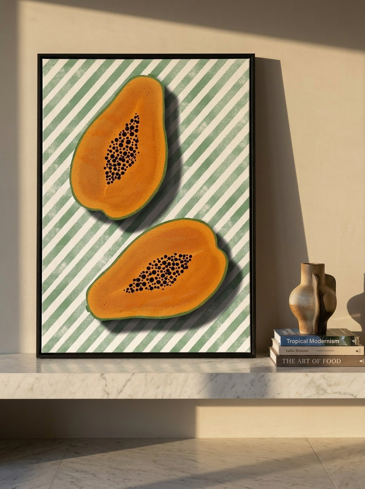 Canvas wall art with a black surround standing on a kitchen bench in a luxe kitchen