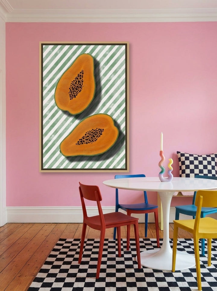 Oversized statement canvas wall art with a natural timber surround styled on the wall in a colourful eclectic dining room