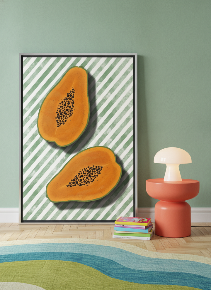 Canvas wall art with a silver leaf surround leaning against the wall in a colourful eclectic living room