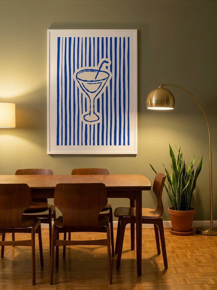 Modern wall art print styled on the wall in a mid-century dining room