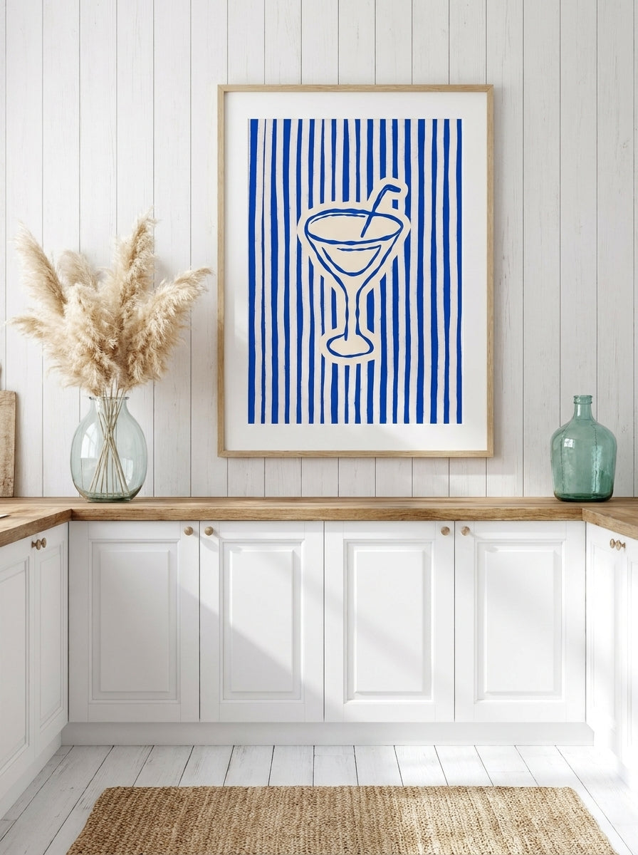 Modern wall art print styled on the wall in a coastal kitchen