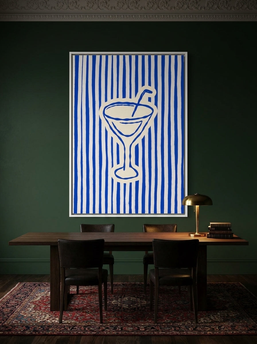 Oversized statement canvas wall art with a white surround styled on the wall in a moody dining room
