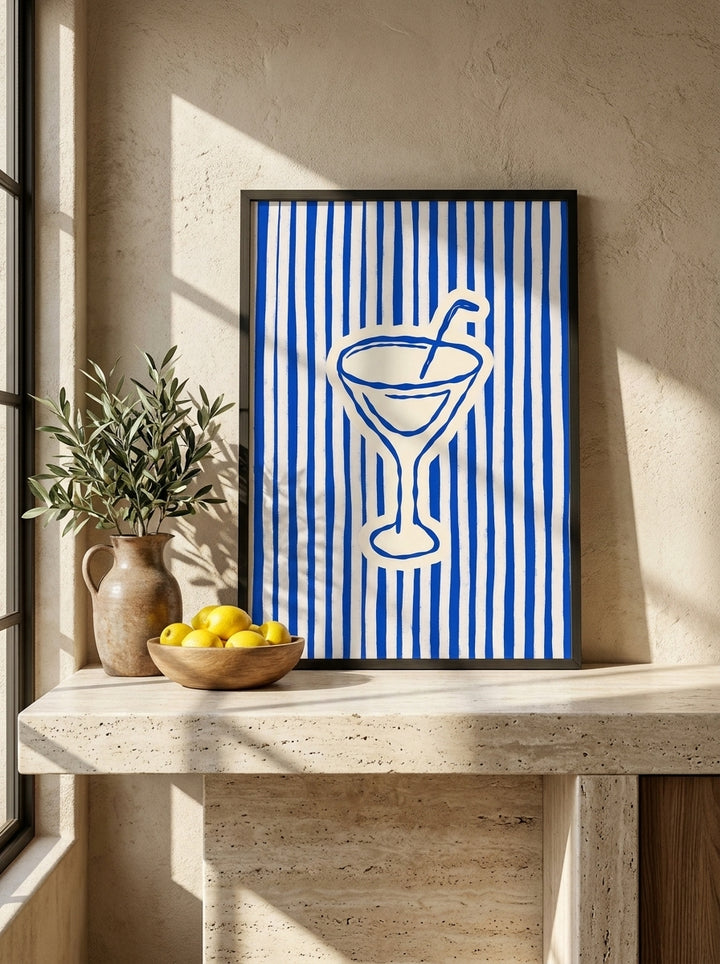 Modern wall art print standing on a kitchen bench in a Mediterranean kitchen