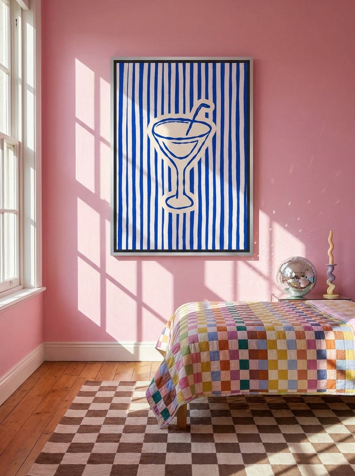 Canvas wall art with a silver leaf surround styled on the wall in a colourful eclectic bedroom