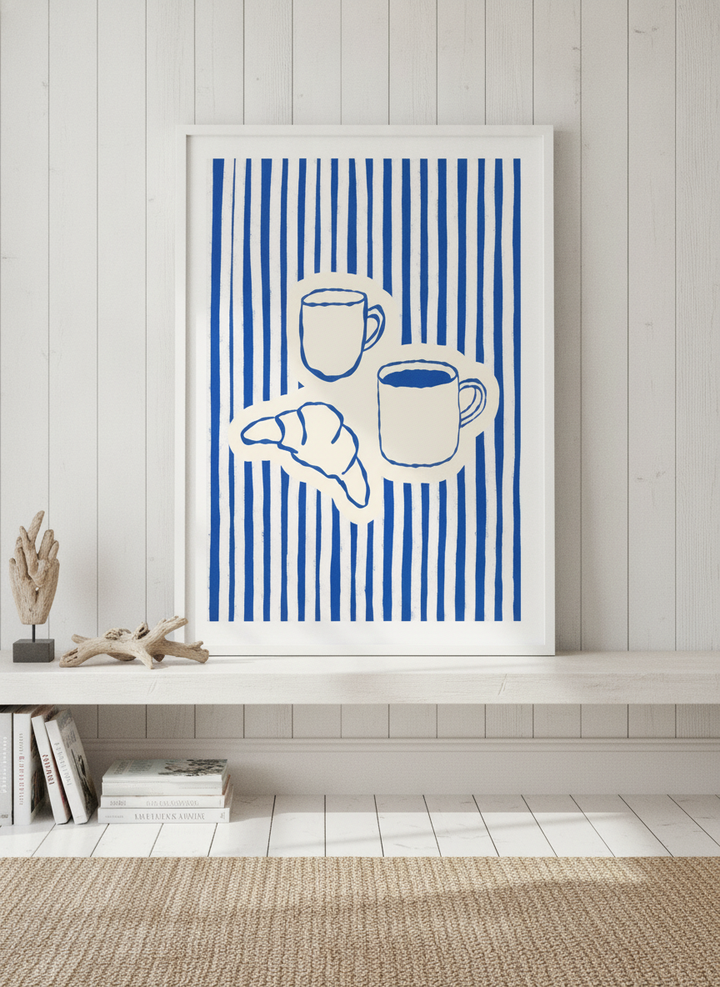 Modern wall art print standing on a console in a coastal living room