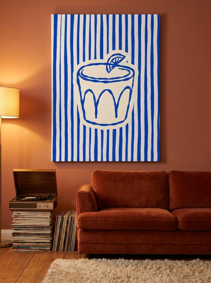 Stretched canvas wall art styled on the wall in a retro 70s living room