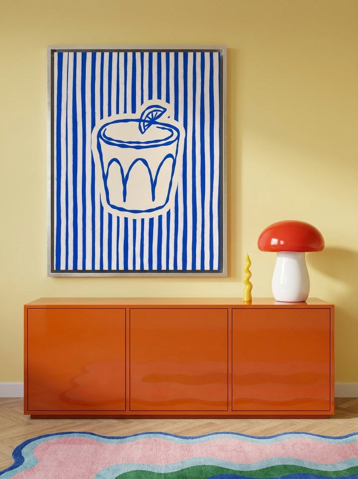 Canvas wall art with a silver leaf surround styled on the wall in a colourful eclectic living room