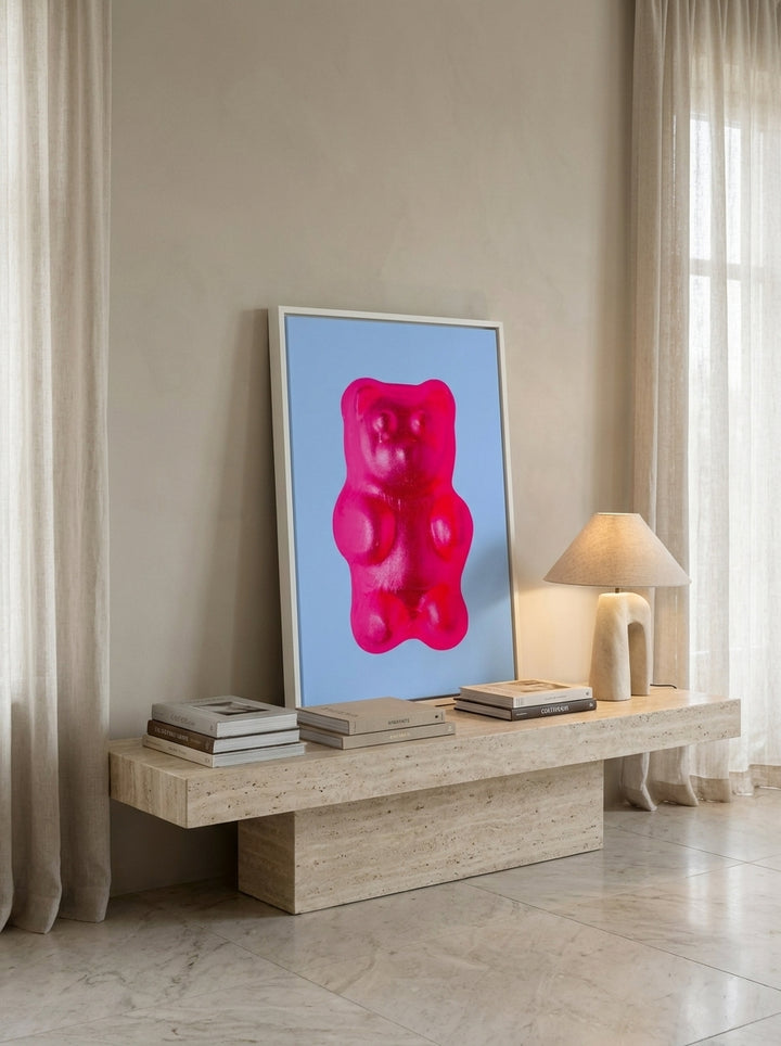 Canvas wall art with a white surround standing on a console in a luxe living room